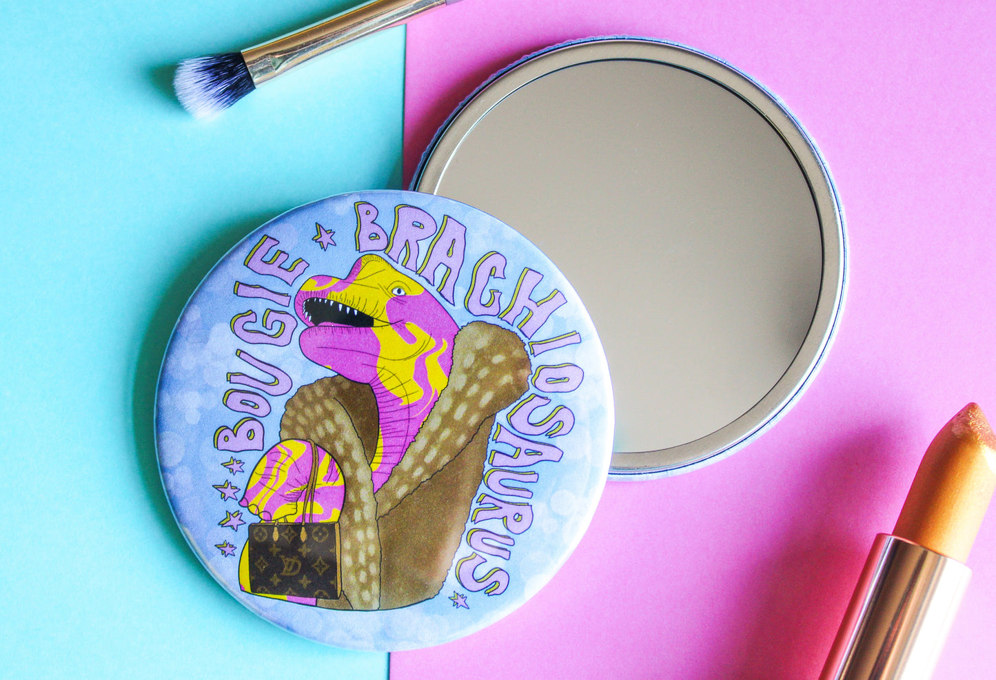 original pocket mirror with a bougie brachiosaurus with fur coat and designer handbag from charlotte rose