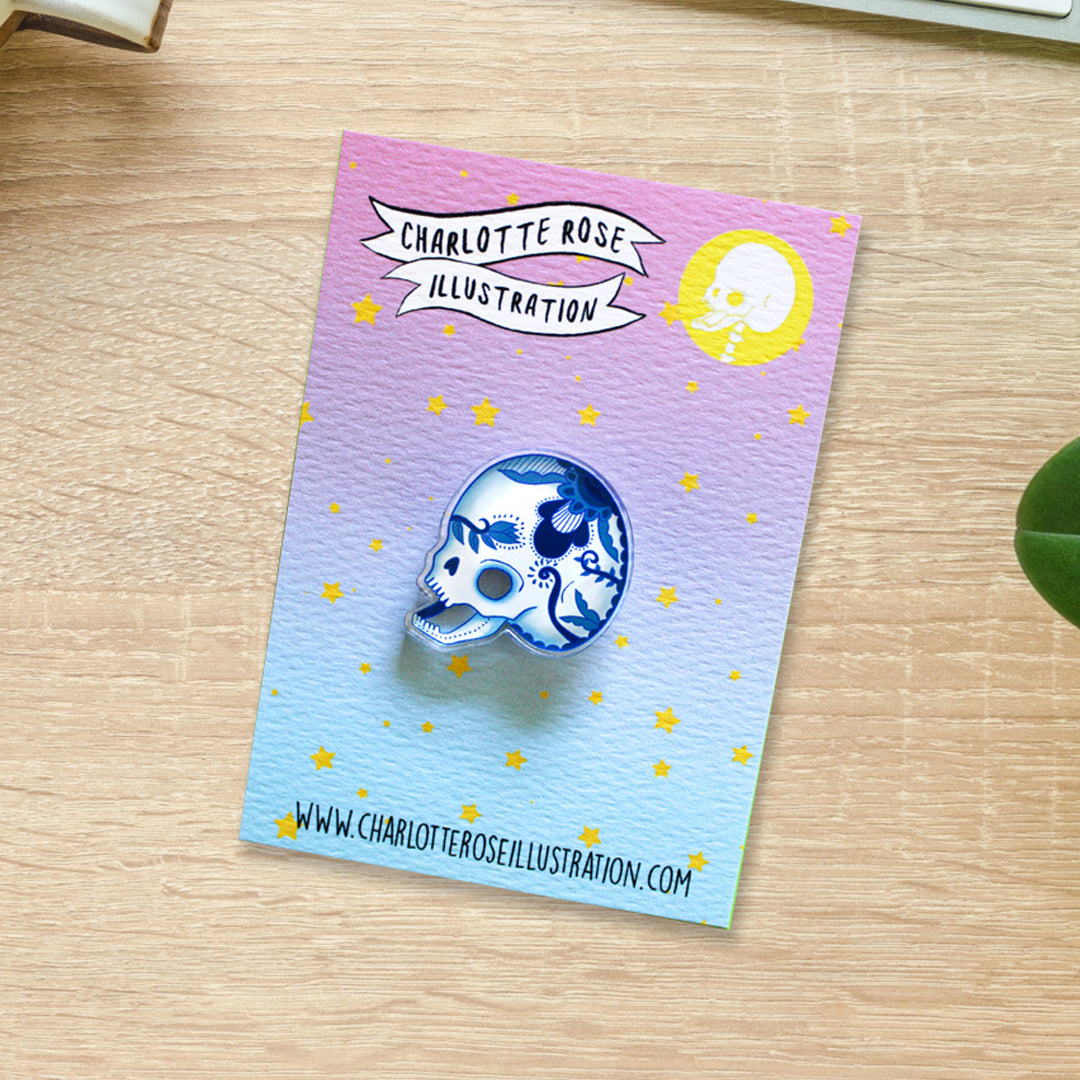 original blue and white delft pottery style floral skull pin bade by charlotte rose