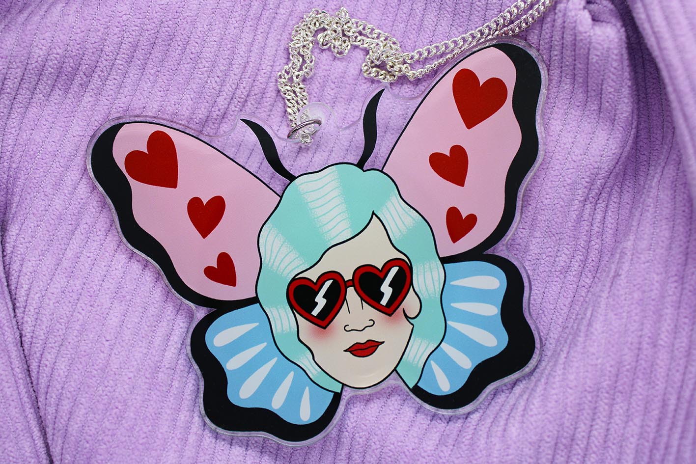 original pink and blue butterfly necklace from charlotte rose lady head with heart sunglasses